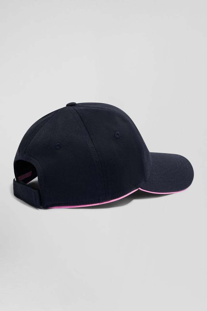 Casquette en coton bleu marine badge nœud papillon passepoil rose